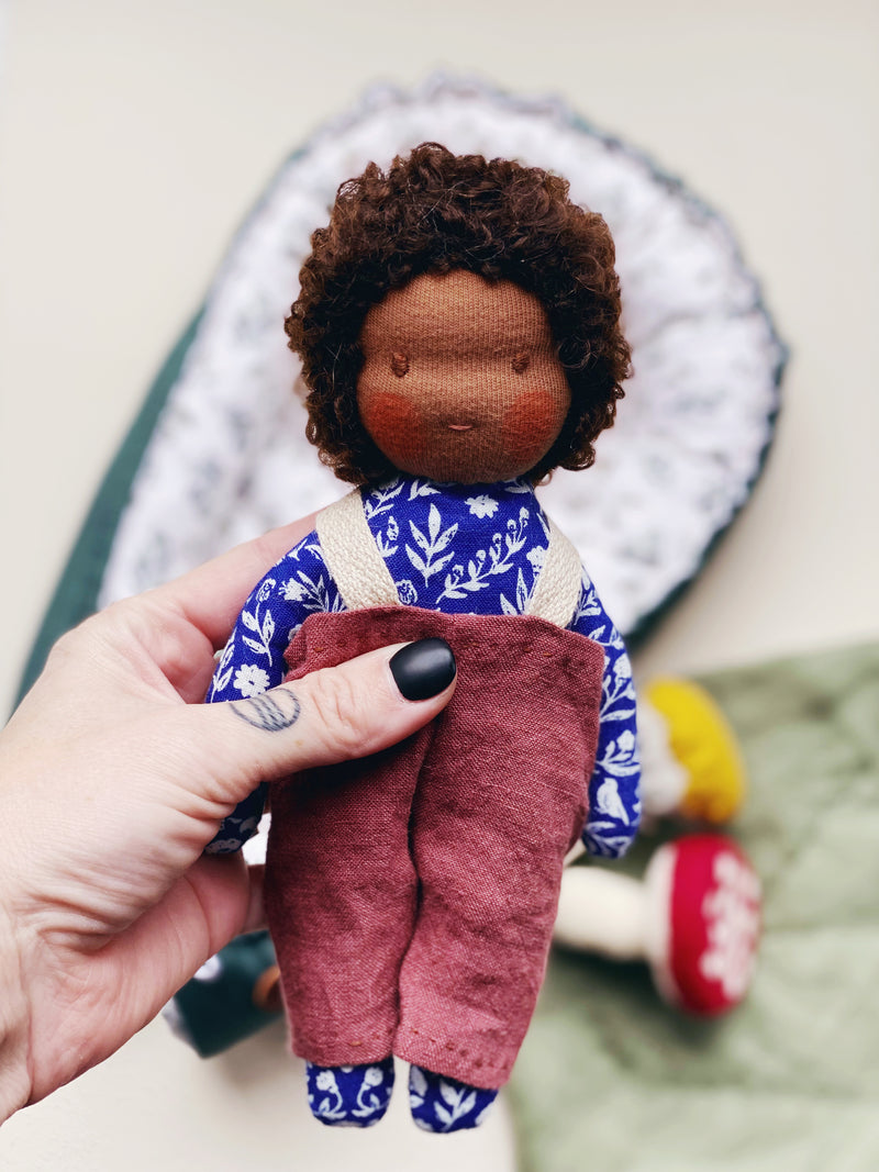 Forager Doll Set Blue Floral Body with Dark Skin Tone, Brown Hair, and Brown Eyes